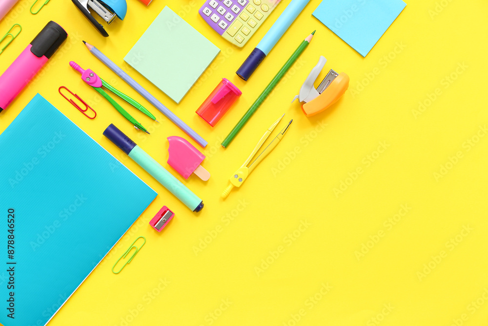 Composition with different stationery on yellow background