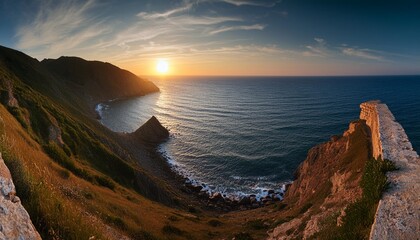 Wall Mural - panoramic view of a coastal seascape at sunset