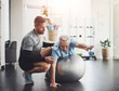 © JorSons/peopleimages.com - Stretching, elderly man and physiotherapist with ball for mobility training, support or muscle workout. Fitness, physiotherapy and senior person with exercise, development or healthcare in retirement