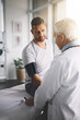 © JorSons/peopleimages.com - Healthcare, man and doctor in office for blood pressure, checkup and assessment in clinic. Advice, patient and medical professional in test for hypertension, cardiology or health consultation