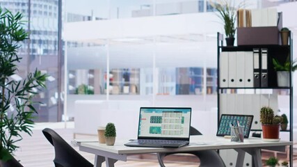 Poster - Empty financial department with stock portfolio on laptops and paperwork files filled with marketing charts. Panning shot of forex exchange indices on notebook device screen