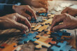 © kavinda - Hands Assembling Puzzle Pieces in a Collaborative Teamwork Activity