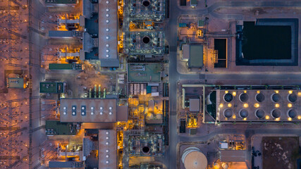 Wall Mural - Aerial view power plant station thermal power plant at night, High voltage electrical power plant factory energy, Combine cycle station high voltage industry factory, Business power and energy.