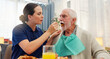 © WesSide/peopleimages.com - Feeding, nurse or senior man in nursing home for elderly care, nutrition or support. Retired male person, caregiver or service for hungry patient in assisted living, healthcare or wellness in morning