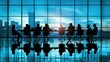 © Zie - Silhouettes of Business Professionals in Meeting with Cityscape View