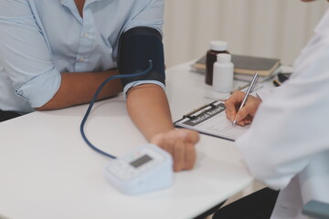 The doctor woman hand use the pulse meter to measure the pressure of the patient, medical checkup concept.