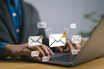Leinwandbilder - Email Spam concept. warning notification and spam message. Person using laptop with Spam email notification on virtual screen.