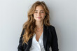 © btiger - Stylish female executive confident in black blazer and suit pants smiling in high resolution studio shot