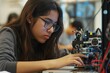 © Fitry - Young Woman Focused on Her STEM Project