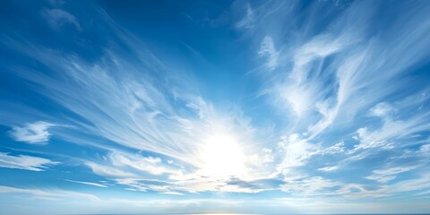 Wall Mural - Tranquil blue sky with wispy clouds forming elegant patterns under the sun. Concept Blue Sky, Wispy Clouds, Elegant Patterns, Tranquil, Sunlit Sky