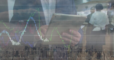 Poster - Image of financial data and graphs over caucasian businessman using tablet