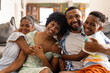 © Wavebreak Media - Biracial family enjoys a cozy moment at home