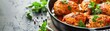 © Chanoknan - Delicious homemade baked chicken thighs seasoned with herbs and spices, garnished with fresh parsley, served in a rustic black skillet.