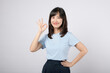 © Jirawatfoto - Okay sign. Successful employee asian woman showing okay gesture in approval, recommending, standing isolated on white background.