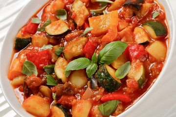 Sticker - hearty italian vegetable stew in bowl, top view