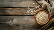 © mila103 - A bowl of oatmeal sits on a wooden table
