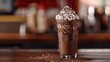 © Mujtaba  - A rich and creamy chocolate milkshake topped with a generous swirl of whipped cream and sprinkled with chocolate shavings, served in a classic diner-style milkshake glass.