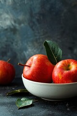 Sticker - Red Apples in a White Bowl on a Dark Surface