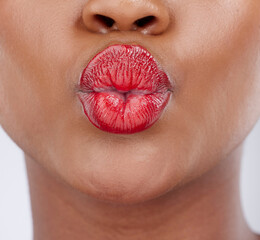 Wall Mural - Beauty, lipstick and pout of woman in studio for cosmetics products, makeup and skincare. Cosmetology, aesthetic and closeup of mouth of person with lipgloss, shine and red color on white background