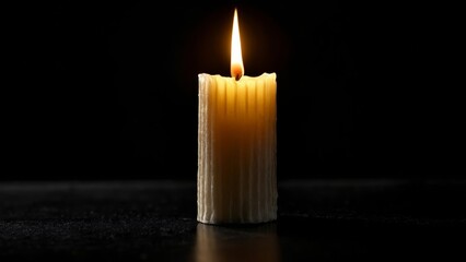 Canvas Print -  A single flame a beacon of hope in the darkness