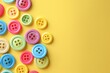 © Fokasu Art - High angle of colorful buttons on pastel yellow background, sewing minimalism, room for text