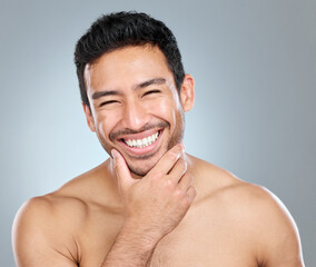 Poster - Beauty, grooming and smile with portrait of man in studio on gray background for cosmetic wellness. Dermatology, masculine and skincare with face of happy person in bathroom for hydration or hygiene