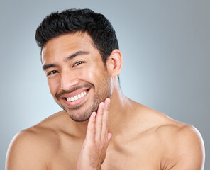 Poster - Beauty, portrait and smile of natural man in studio on gray background for cosmetic wellness. Dermatology, grooming and skincare with face of happy person in bathroom for hydration or hygiene