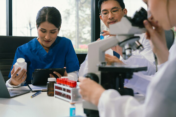 Wall Mural - doctor team, analysis the blood test examination results and medication usage of the patient on the 