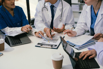 Wall Mural - doctor team, analysis the blood test examination results and medication usage of the patient on the 
