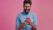© Trendy Graphics - Happy 30s Indian man staring at mobile phone screen celebrate success, get bonus or money refund, reading about lottery victory, receive great news in message, make yes gesture feels overjoyed