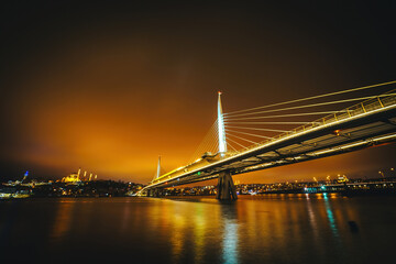 Golden Horn Metro Bridge. Photograph of the modern metro bridge taken at sunset over the estuary in Istanbul, Turkey.