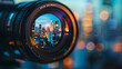 © sornram - Close-up of a camera lens capturing a cityscape in sharp focus, with vibrant urban lights and bokeh effect in the background at dusk.