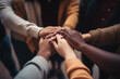 © Mirjana - Close up of diverse people putting hands in stack.