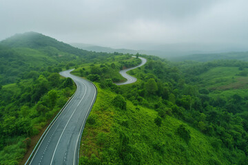 Wall Mural - Aerial top view of road in the mountain forest, transportation camping concept.