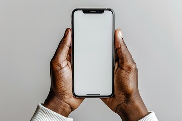 A person is holding a white Phone in their hand