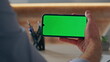 © stockbusters - Unrecognizable manager using mockup smartphone sitting corporate office closeup