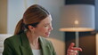 © stockbusters - Excited lady speaking laptop call at open space office closeup. Woman talking