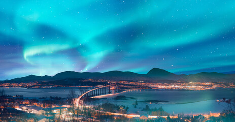 Wall Mural - Aurora borealis or Northern lights in the sky over Tromso with Sandnessundet Bridge - Tromso, Norway