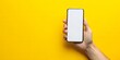 © Transparent png - Hand Holding Smartphone with Blank Screen on Yellow Background