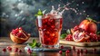 © arri - Refreshing pomegranate juice drink with splash and mint