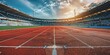 © Larisa - Sunset at empty track and field stadium with clear skies