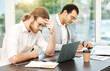 © AzeemudDeen/peopleimages.com - Business, people and stress with strategy in office for project deadline with teamwork and collaboration. Partners, employees and burnout headache in boardroom with laptop or documents for research