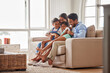 © Alex Shared/peopleimages.com - Family, couch and hug in home living room for support, relax and unity with parents in lounge. Love, together and house for calm with mom and dad, bonding and smile and weekend holiday in Florida