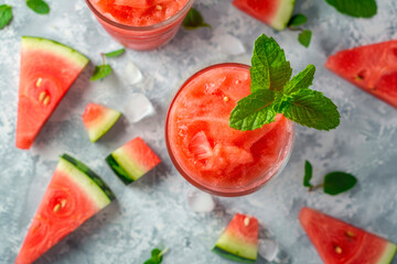 Sticker - Watermelon Slushie Garnish with Mint and Watermelon Sliced on gray stone. Top view