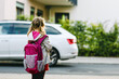 © Irina Schmidt - Cute little preschool girl going to playschool. Healthy toddler child walking to nursery school and kindergarten. Happy child with backpack on the city street, outdoors.