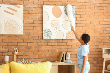 Poster - Cute little African-American boy cleaning dust in living room