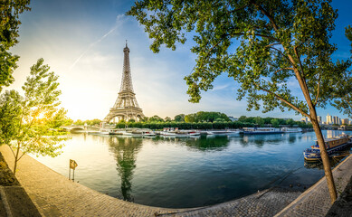 Wall Mural - paris eiffel tower and river seine with sunrise sun in paris, france. eiffel tower is one of the mos
