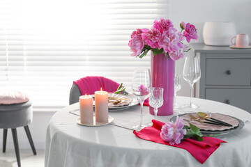 Wall Mural - Beautiful table setting with pink peonies and burning candles