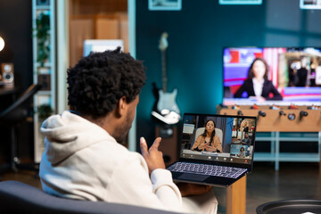 Poster - African american man and coworkers in teleconference crosschecking analytics statistical data sets from apartment office. Remote worker optimizing KPIs with colleagues in videocall