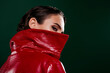 © Beauty Hero - Photo of mysterious lady hide her face behind red fashionable coat isolated dark color background